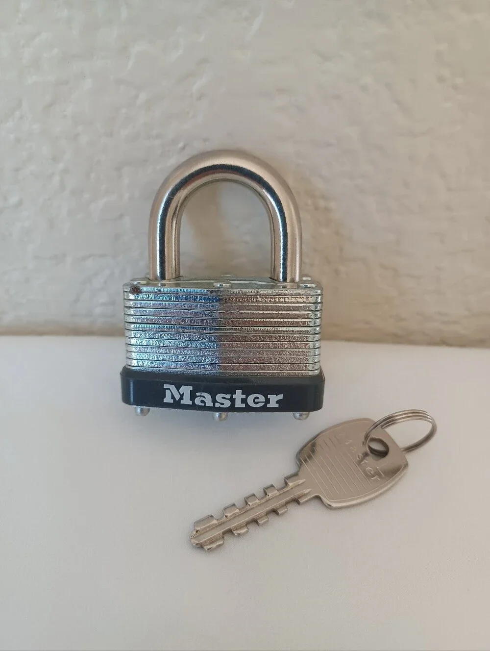 Master Lock Laminated Steel Warded Padlock with Key